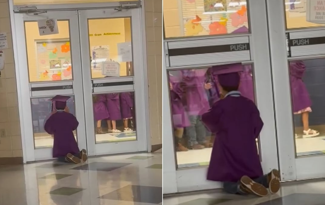 Niño mirando por una ventana de vidrio