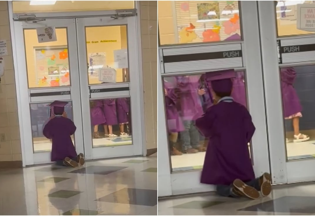 Niño mirando por una ventana de vidrio